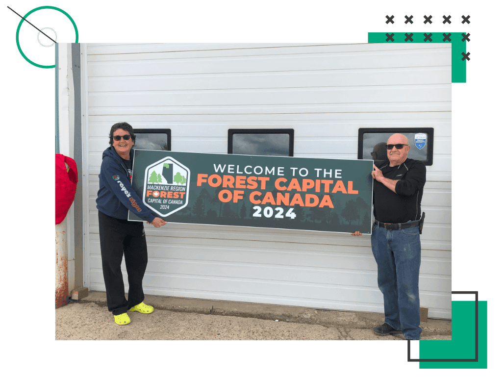 Raye's Signs owners holding FCC 2024 Welcome Sign.